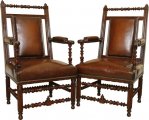A stunning pair of 19th century open arm chairs